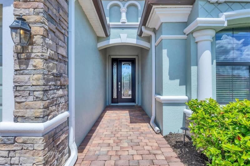 Stone and stucco entrance path to the front door