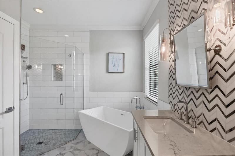 Main bathroom with freestanding tub and glass shower