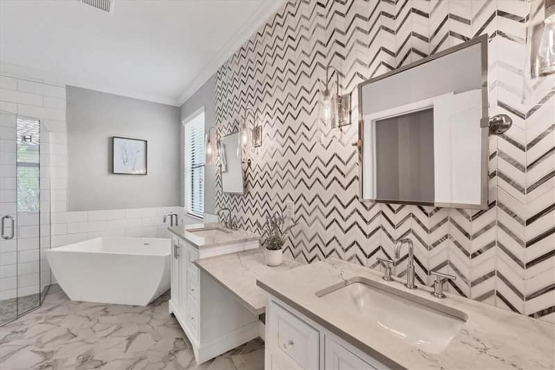 Bathroom with a large bathtub and double sink vanity
