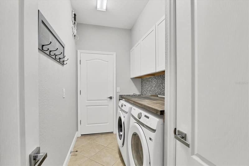 Laundry room with washing machine and dryer