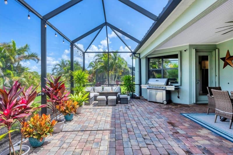 Grill and outdoor furniture on the lanai