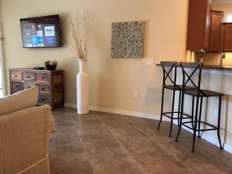 Living area with the bar and stools